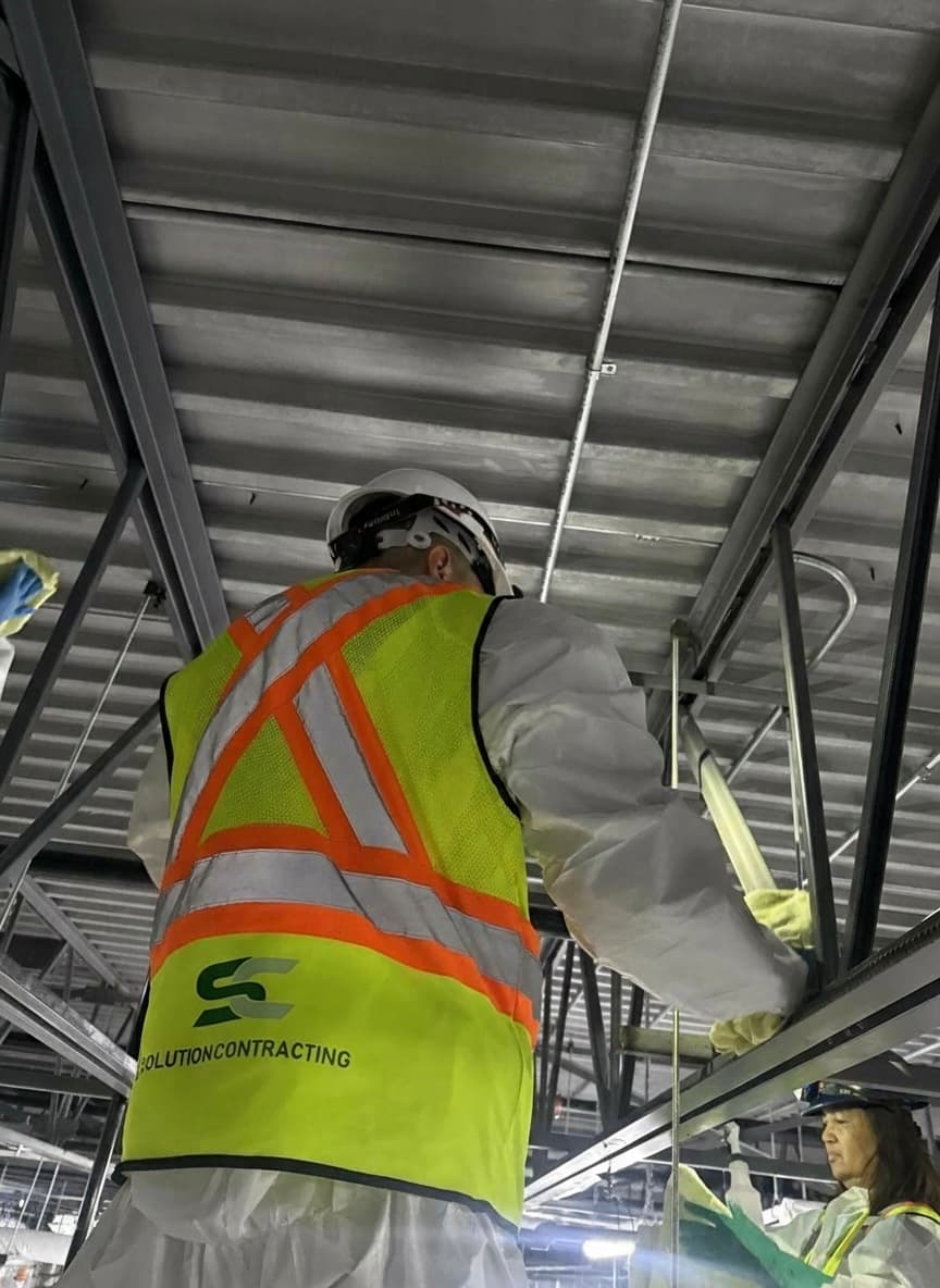Image of a man in a safety vest.