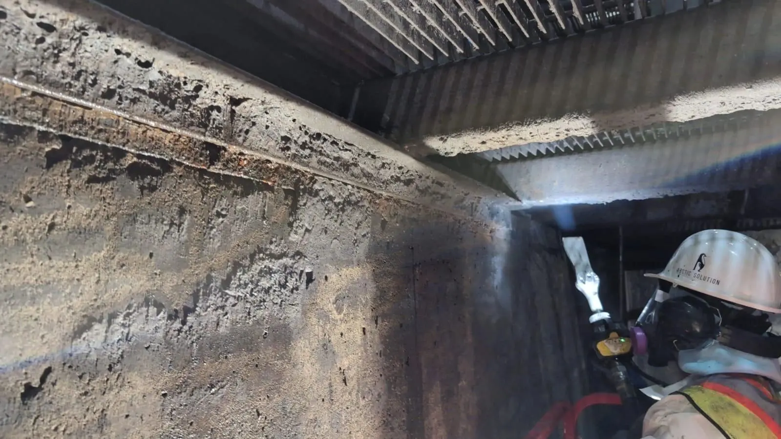 A contractor doing media blasting.